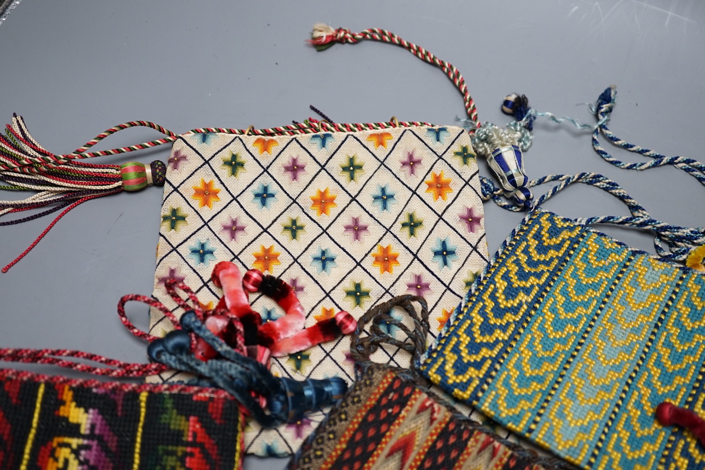 Ten 19th century embroidered and woolworked bible bags, largest 18 x 16cm